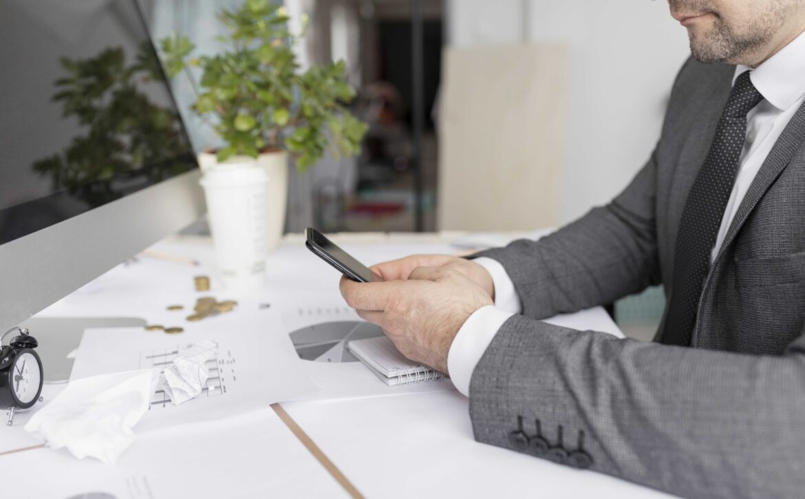 man-checking-his-phone-job