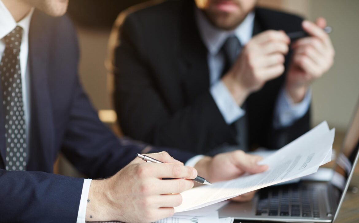 Successful Business Partners Discussing Contract